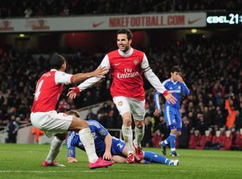 <a href="https://www.theepochtimes.com/assets/uploads/2015/07/Arsenal107790639_medium.jpg"><img src="https://www.theepochtimes.com/assets/uploads/2015/07/Arsenal107790639_medium.jpg" alt="Cesc Fabregas (right) and Theo Walcott celebrate Arsenal's second of three goals against Chelsea on Monday. (Shaun Botterill/Getty Images)" title="Cesc Fabregas (right) and Theo Walcott celebrate Arsenal's second of three goals against Chelsea on Monday. (Shaun Botterill/Getty Images)" width="320" class="size-medium wp-image-117813"/></a>