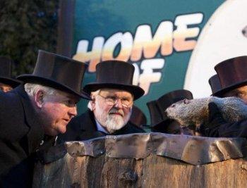 <a href="https://www.theepochtimes.com/assets/uploads/2015/07/Bill_speaks_to_Phile_medium.jpg"><img class="size-medium wp-image-119804" title="Bill Deeley (L), Punxsutawney Groundhog Club president speaks to Phil in Groundhogese, getting Phil's winter weather prediction for 2010. To his right is Mike Johnston, vice-president, and holding Phil is John Griffiths, one Phil's two handlers. (Jan Jekielek/The Epoch Times)" src="https://www.theepochtimes.com/assets/uploads/2015/07/Bill_speaks_to_Phile_medium.jpg" alt="Bill Deeley (L), Punxsutawney Groundhog Club president speaks to Phil in Groundhogese, getting Phil's winter weather prediction for 2010. To his right is Mike Johnston, vice-president, and holding Phil is John Griffiths, one Phil's two handlers. (Jan Jekielek/The Epoch Times)" width="320"/></a>