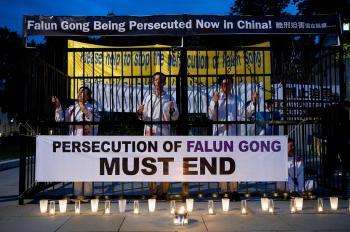 <a href="https://www.theepochtimes.com/assets/uploads/2015/07/Candlelight_vigil_parliament2_medium.jpg"><img src="https://www.theepochtimes.com/assets/uploads/2015/07/Candlelight_vigil_parliament2_medium.jpg" alt="A rally of Falun Gong practitioners on Parliament Square in London on July 20 includes a dramatisation of the detention and torture of Falun Gong practitioners in China. (Edward Stephen/Epoch Times Staff)" title="A rally of Falun Gong practitioners on Parliament Square in London on July 20 includes a dramatisation of the detention and torture of Falun Gong practitioners in China. (Edward Stephen/Epoch Times Staff)" width="320" class="size-medium wp-image-89576"/></a>