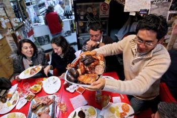 <a href="https://www.theepochtimes.com/assets/uploads/2015/07/Chilean_BBQ-resized_medium.jpg"><img src="https://www.theepochtimes.com/assets/uploads/2015/07/Chilean_BBQ-resized_medium.jpg" alt="Tourists share barbecued meat at 'Los Canallas' restaurant in downtown Santiago. (Geraldo Caso/AFP/Getty Images)" title="Tourists share barbecued meat at 'Los Canallas' restaurant in downtown Santiago. (Geraldo Caso/AFP/Getty Images)" width="320" class="size-medium wp-image-88416"/></a>