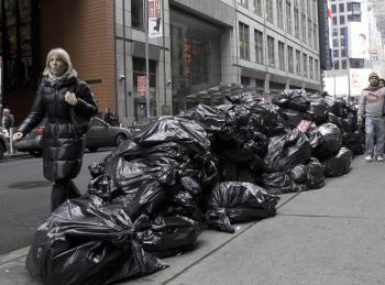 The Department of Sanitation will resume trash pickup in New York City on Monday. Collection was suspended due to the snowstorm that hit the city on Dec. 26. (Phoebe Zheng/The Epoch Times)