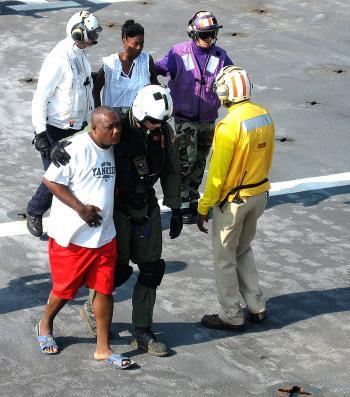 <a href="https://www.theepochtimes.com/assets/uploads/2015/07/Haiti+USN_medium.jpg"><img src="https://www.theepochtimes.com/assets/uploads/2015/07/Haiti+USN_medium.jpg" alt="Navy flight deck personnel escort injured Haitians to the casualty receiving section of the USNS Comfort hospital ship on Jan. 20. (Jim Garamone)" title="Navy flight deck personnel escort injured Haitians to the casualty receiving section of the USNS Comfort hospital ship on Jan. 20. (Jim Garamone)" width="320" class="size-medium wp-image-98433"/></a>