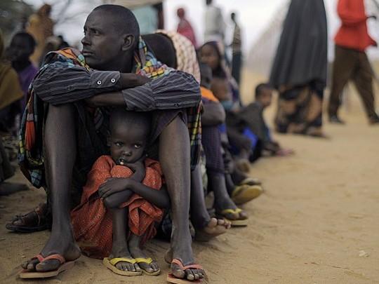 <a href="https://www.theepochtimes.com/assets/uploads/2015/07/SOMALI-120247348.jpg"><img class="wp-image-267868" title=" A Somali father and daughter wait at a registration centre on Aug. 2, 2011, at the Dadaab refugee camp in Kenya after famine forced them from home. (TONY KARUMBA/AFP/Getty Images)" src="https://www.theepochtimes.com/assets/uploads/2015/07/SOMALI-120247348.jpg" alt=" A Somali father and daughter wait at a registration centre on Aug. 2, 2011, at the Dadaab refugee camp in Kenya after famine forced them from home. (TONY KARUMBA/AFP/Getty Images)" width="585" height="437"/></a>