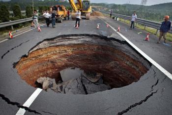 <a href="https://www.theepochtimes.com/assets/uploads/2015/07/ZhejiangSinkHole-1_medium.jpg"><img src="https://www.theepochtimes.com/assets/uploads/2015/07/ZhejiangSinkHole-1_medium.jpg" alt="A sinkhole occurred on June 4 on a freeway in China's Zhejiang Province. (Photographer name withheld by request)" title="A sinkhole occurred on June 4 on a freeway in China's Zhejiang Province. (Photographer name withheld by request)" width="320" class="size-medium wp-image-106837"/></a>