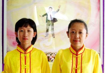 <a href="https://www.theepochtimes.com/assets/uploads/2015/07/xparadethailand_medium.jpg"><img src="https://www.theepochtimes.com/assets/uploads/2015/07/xparadethailand_medium.jpg" alt="Jing Cai (L) and Jing Tian prepare for a Falun Dafa parade in Thailand.  (Courtesy of Jing Tian)" title="Jing Cai (L) and Jing Tian prepare for a Falun Dafa parade in Thailand.  (Courtesy of Jing Tian)" width="320" class="size-medium wp-image-89834"/></a>