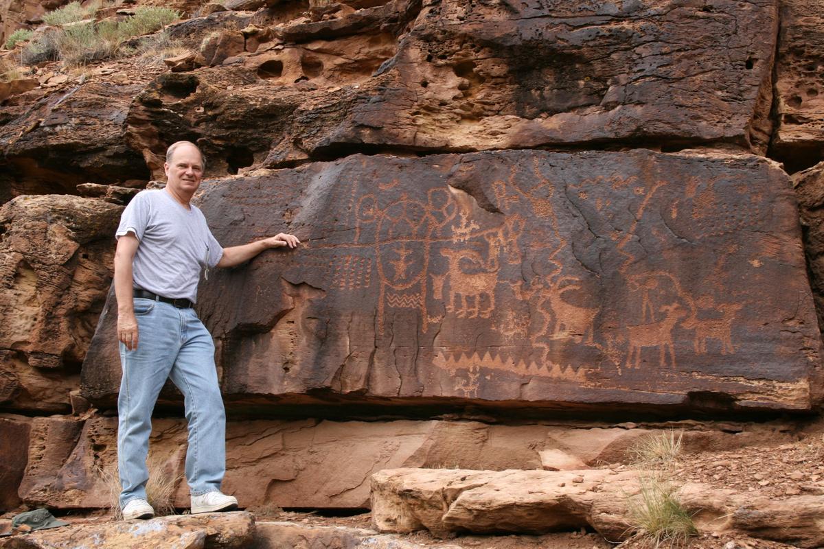 John A. Ruskamp stands near petroglyphs that match ancient Chinese script in Nine Mile Canyon, Utah. (Courtesy of John A. Ruskamp)