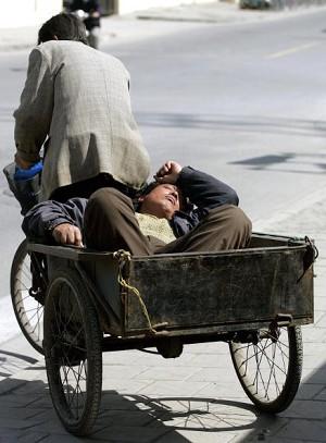 Pedicab carries both goods and passenger (AFP/Getty Images