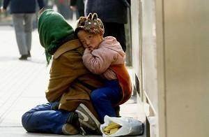 A beggar and her child (Getty Images)