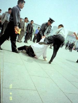 Plain-cloth police brutally arrest Falun Gong practitioners on Tiananmen Square. "The 6-10 Office's singular capacity for terror depends, first of all, on the way it penetrates every aspect of Chinese society, from the top to the bottom." (Compassion Magazine)