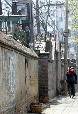 A soldier mans the watchtower monitoring the entrance of Zhao's residence on April 14, 2004. (Getty Images)
