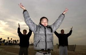 Cindy Lee practices Falun Dafa exercises at Santa Monica State Beach in Santa Monica, CA. (David McNew/Newsmakers)