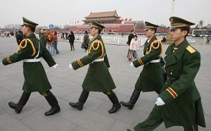 Large numbers of armed policemen patrol Tiananmen Square during conference session, March 8, 2006.