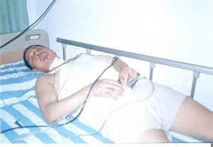 Photo of village representative Huang Shuming who was brutally beaten. His face was swollen, his head felt giddy and his groin was red and swollen. (The Epoch Times)