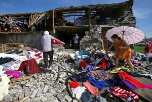 People salvage personal posessions from house damaged by the typhoon (China Photos/Getty Images)