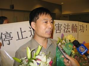Yuan Sheng during an August 9 interview at New York's Kennedy Airport. (The Epoch Times)
