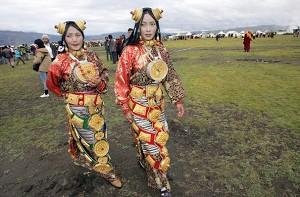 Young Tibetan women dressed in traditional costumes at a festival in Litang County. (Liu Jin/AFP/Getty Images)