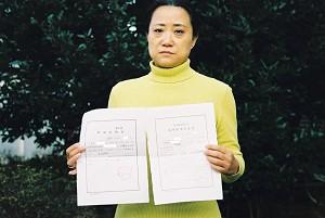 Miao, a housewife living a quiet life never imagined she would  ever be held by the police. "Suspicion of illegally possessing  national secrets" say the documents. (Yodo Soma)