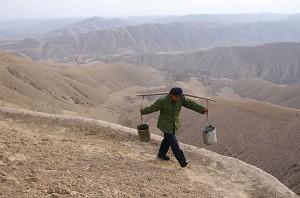 Villagers travel several miles of mountain range to fetch their daily water. (The Epoch Times)