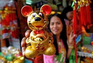February 5, 2008, Manila, Philippines, gold plated Rat decorations are sold in shops. (Jay Directo/AFP/Getty Images)