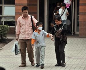 A child leaves a children's hospital in Beijing on May 7, 2008. (Peter Parks/AFP/Getty Images)