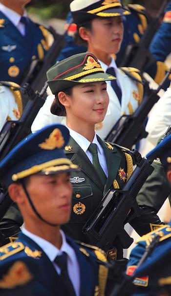 Men Jiahui (C), a 23-year-old Chinese model, marches in a military parade rehearsal in Beijing on Aug, 5, 2015. (Screen shot/Sina)
