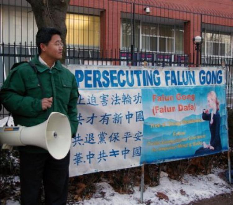<a><img src="https://www.theepochtimes.com/assets/uploads/2015/09/07.jpg" alt="Falun Gong practitioner Haitao Wang, who this week came within one day of being deported, attends a demonstration in Toronto against the persecution of Falun Gong in China.  (The Epoch Times)" title="Falun Gong practitioner Haitao Wang, who this week came within one day of being deported, attends a demonstration in Toronto against the persecution of Falun Gong in China.  (The Epoch Times)" width="320" class="size-medium wp-image-1832453"/></a>