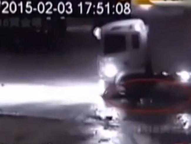 A truck driver rolls over a boy four times. (CCTV / screenshot)