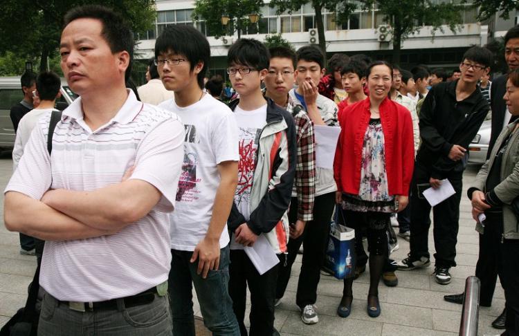 <a><img src="https://www.theepochtimes.com/assets/uploads/2015/09/1005291821402074.jpg" alt="Applicants wait in line to be interviewed at the Nanjing Normal College for Childhood Education. (The Epoch Times Photo Archive)" title="Applicants wait in line to be interviewed at the Nanjing Normal College for Childhood Education. (The Epoch Times Photo Archive)" width="320" class="size-medium wp-image-1819019"/></a>