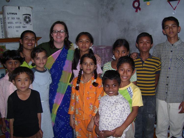 <a><img src="https://www.theepochtimes.com/assets/uploads/2015/09/100_0891.jpg" alt="Sue van Schreven (fifth from left) is surrounded by happy children as she continues her work with Orphans Aid International. (Photo Courtesy of Sue van Schreven)" title="Sue van Schreven (fifth from left) is surrounded by happy children as she continues her work with Orphans Aid International. (Photo Courtesy of Sue van Schreven)" width="320" class="size-medium wp-image-1834605"/></a>