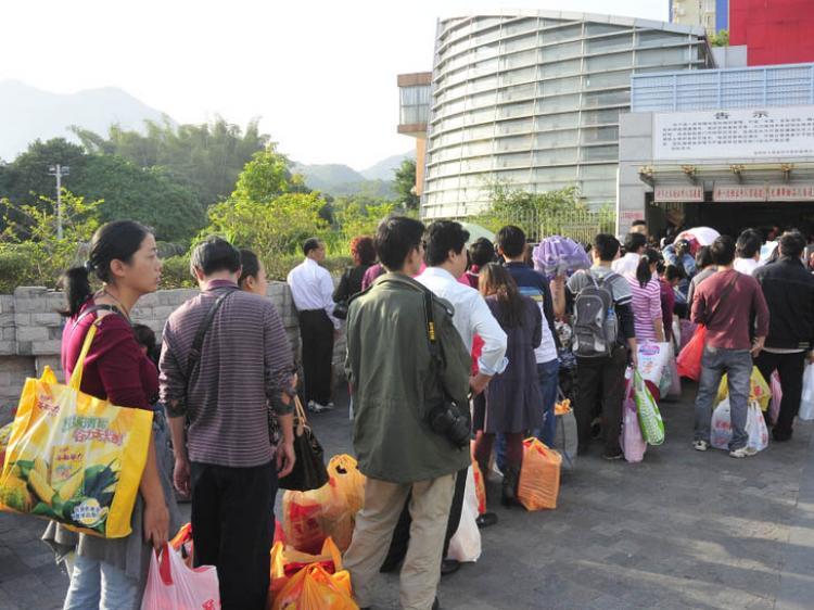 <a><img src="https://www.theepochtimes.com/assets/uploads/2015/09/1011232146092054.jpg" alt="Chinese wait in line before Shenzhen Customs District building after shopping in Hong Kong. China's inflation has caused many Chinese to travel to Hong Kong to shop for necessities.  (Epoch Times archive)" title="Chinese wait in line before Shenzhen Customs District building after shopping in Hong Kong. China's inflation has caused many Chinese to travel to Hong Kong to shop for necessities.  (Epoch Times archive)" width="320" class="size-medium wp-image-1811360"/></a>