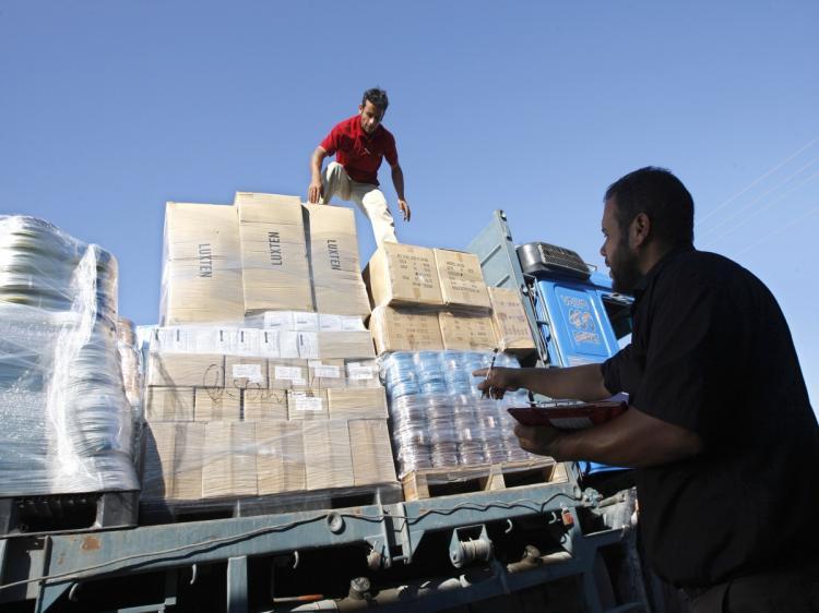 <a><img src="https://www.theepochtimes.com/assets/uploads/2015/09/102657255-Gaza_Supplies.jpg" alt="Palestinian workers inspect trucks carrying supplies after it arrived in Rafah town through the Kerem Shalom crossing between Israel and the southern Gaza Strip on July 06, 2010, as Israel gave the go-ahead for the international community to import construction materials into the Hamas-run Gaza Strip in an easing of its blockade that won cautious praise. (Said Khatib/AFP/Getty Images)" title="Palestinian workers inspect trucks carrying supplies after it arrived in Rafah town through the Kerem Shalom crossing between Israel and the southern Gaza Strip on July 06, 2010, as Israel gave the go-ahead for the international community to import construction materials into the Hamas-run Gaza Strip in an easing of its blockade that won cautious praise. (Said Khatib/AFP/Getty Images)" width="320" class="size-medium wp-image-1817723"/></a>