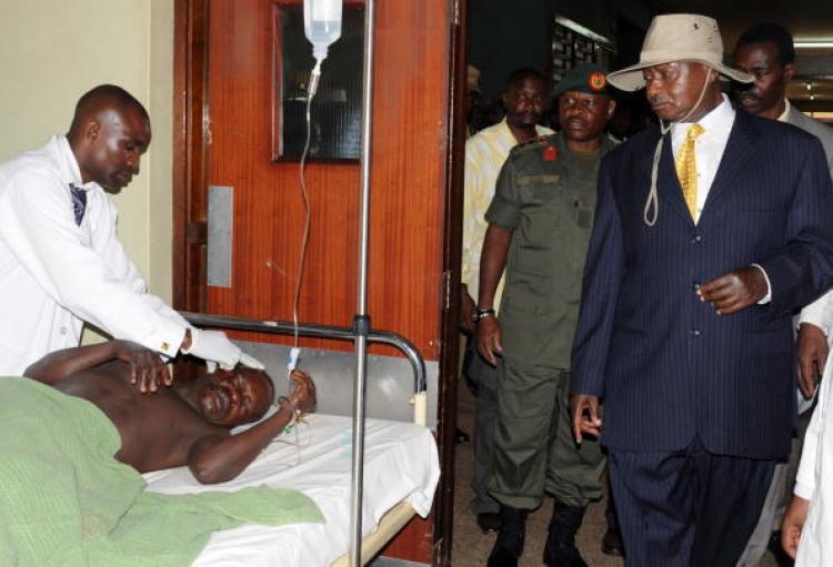 <a><img src="https://www.theepochtimes.com/assets/uploads/2015/09/102828883.jpg" alt="Uganda's President Yoweri Museveni visits a victim in Kampala's Mulago Hospital on July 12, after twin bomb blasts tore through crowds of football fans watching the World Cup final, killing 74 people. (Peter Busomoke/Getty Images )" title="Uganda's President Yoweri Museveni visits a victim in Kampala's Mulago Hospital on July 12, after twin bomb blasts tore through crowds of football fans watching the World Cup final, killing 74 people. (Peter Busomoke/Getty Images )" width="320" class="size-medium wp-image-1817321"/></a>