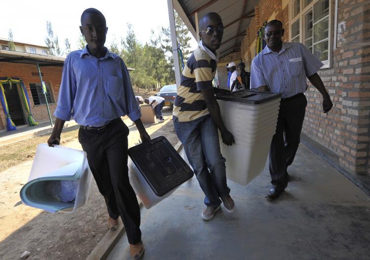 <a><img src="https://www.theepochtimes.com/assets/uploads/2015/09/103290072.jpg" alt="Rwanda electoral agents carry ballot boxes to Kakiro polling station in Kigali, on the eve of the country's presidential election, on August 8, in Kigali.  (Simon Maina/Getty Images)" title="Rwanda electoral agents carry ballot boxes to Kakiro polling station in Kigali, on the eve of the country's presidential election, on August 8, in Kigali.  (Simon Maina/Getty Images)" width="320" class="size-medium wp-image-1816427"/></a>