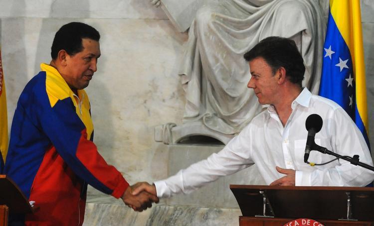 <a><img src="https://www.theepochtimes.com/assets/uploads/2015/09/103334652.jpg" alt="Colombian President Juan Manuel Santos (R) shakes hands with his Venezuelan counterpart Hugo Chavez during a joint press conference announcing that their countries resumed diplomatic relations at the Quinta de San Pedro Alejandrino in Santa Marta, Magdalena department, Colombia on August 10. (Rodrigo Arangua/Getty Images )" title="Colombian President Juan Manuel Santos (R) shakes hands with his Venezuelan counterpart Hugo Chavez during a joint press conference announcing that their countries resumed diplomatic relations at the Quinta de San Pedro Alejandrino in Santa Marta, Magdalena department, Colombia on August 10. (Rodrigo Arangua/Getty Images )" width="320" class="size-medium wp-image-1816230"/></a>