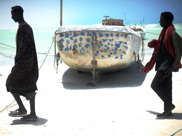 <a><img src="https://www.theepochtimes.com/assets/uploads/2015/09/103782882_Somali_Fisherman.jpg" alt="WILD WATERS: Two fishermen, some of the few left in town, walk past a small fishing vessel in the central Somali town of Hobyo. (Roberto Schmidt/AFP/Getty Images)" title="WILD WATERS: Two fishermen, some of the few left in town, walk past a small fishing vessel in the central Somali town of Hobyo. (Roberto Schmidt/AFP/Getty Images)" width="575" class="size-medium wp-image-1801785"/></a>