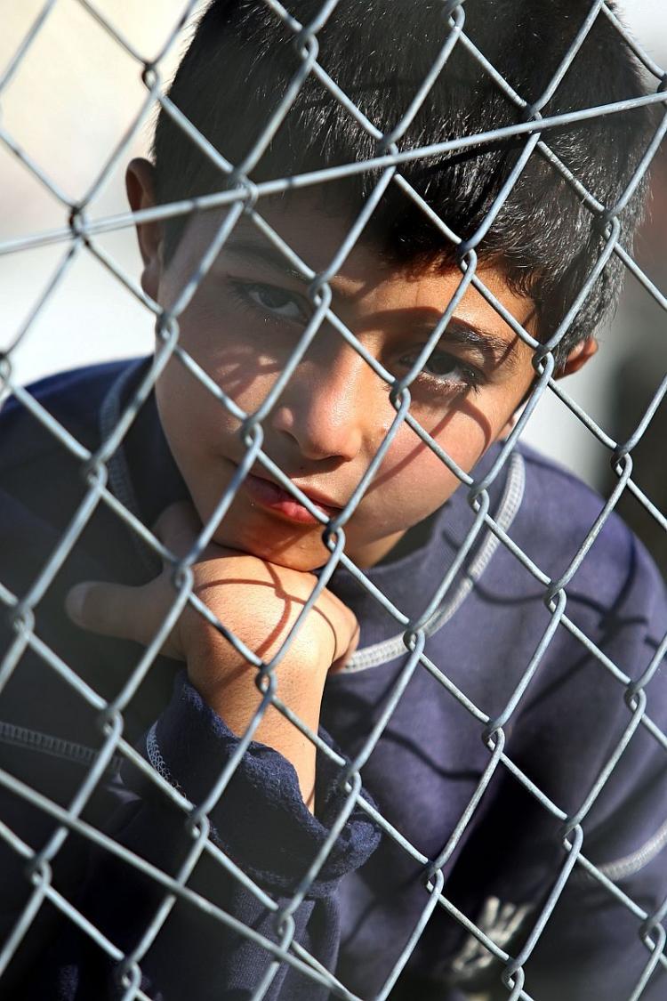 <a><img src="https://www.theepochtimes.com/assets/uploads/2015/09/106566633_2.jpg" alt="An immigrant child looking through a fence.(By: Sakis Mitrolidis/AFP/Getty Images)" title="An immigrant child looking through a fence.(By: Sakis Mitrolidis/AFP/Getty Images)" width="320" class="size-medium wp-image-1811303"/></a>