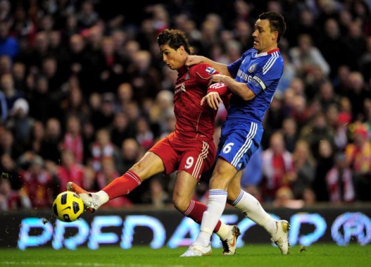 <a><img src="https://www.theepochtimes.com/assets/uploads/2015/09/106612252.jpg" alt="Chelsea's John Terry shadows Liverpool's Fernando Torres (L), who controls the ball under pressure. (Shaun Botterill/Getty Images)" title="Chelsea's John Terry shadows Liverpool's Fernando Torres (L), who controls the ball under pressure. (Shaun Botterill/Getty Images)" width="320" class="size-medium wp-image-1812430"/></a>