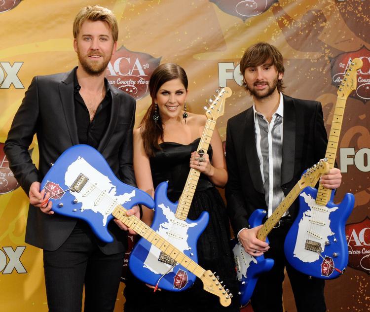 <a><img src="https://www.theepochtimes.com/assets/uploads/2015/09/107366318.jpg" alt="Lady Antebellum's (L-R) Charles Kelley, Hillary Scott, and Dave Haywood pose at the American Country Awards on Dec. 6, 2010 in Las Vegas. The country trio won Song of the Year and Best Country Album at the 53rd annual Grammy Awards on Feb. 13. (Ethan Miller/Getty Images)" title="Lady Antebellum's (L-R) Charles Kelley, Hillary Scott, and Dave Haywood pose at the American Country Awards on Dec. 6, 2010 in Las Vegas. The country trio won Song of the Year and Best Country Album at the 53rd annual Grammy Awards on Feb. 13. (Ethan Miller/Getty Images)" width="320" class="size-medium wp-image-1808392"/></a>