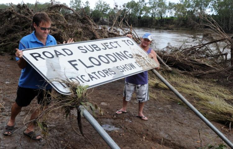 <a><img src="https://www.theepochtimes.com/assets/uploads/2015/09/107844171.jpg" alt="Greg Messenger (L) and Gary Clem (R) try to restore a flood warning sign which had been flattened by the swollen Burnett River on Jan. 2, 2011.  (Torsten Blackwood/AFP/Getty Images)" title="Greg Messenger (L) and Gary Clem (R) try to restore a flood warning sign which had been flattened by the swollen Burnett River on Jan. 2, 2011.  (Torsten Blackwood/AFP/Getty Images)" width="320" class="size-medium wp-image-1810230"/></a>