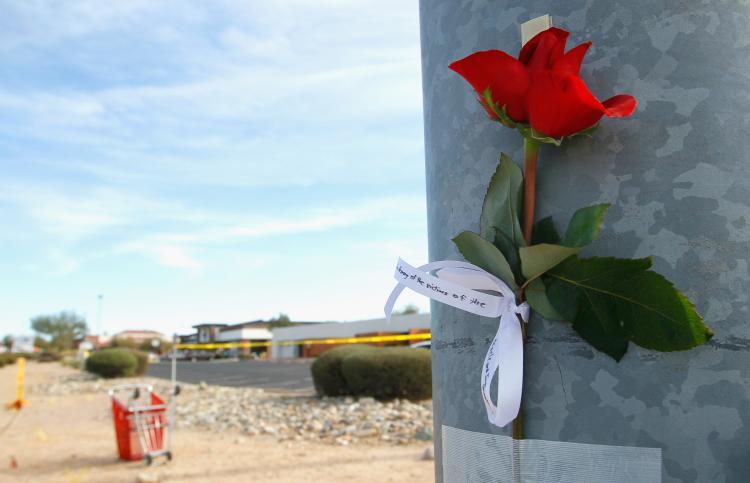 <a><img src="https://www.theepochtimes.com/assets/uploads/2015/09/107948667.jpg" alt="A single rose with the words 'In Memory of the victims of the Oracle and Ina Shooting' written on a ribbon is taped to a lamp post at the intersection of West Ina and North Oracle roads near the Safeway grocery store where a person allegedly opened fire on a group of people on January 9, 2011 in Tucson, Arizona. (Kevin C. Cox/Getty Images)" title="A single rose with the words 'In Memory of the victims of the Oracle and Ina Shooting' written on a ribbon is taped to a lamp post at the intersection of West Ina and North Oracle roads near the Safeway grocery store where a person allegedly opened fire on a group of people on January 9, 2011 in Tucson, Arizona. (Kevin C. Cox/Getty Images)" width="320" class="size-medium wp-image-1809909"/></a>