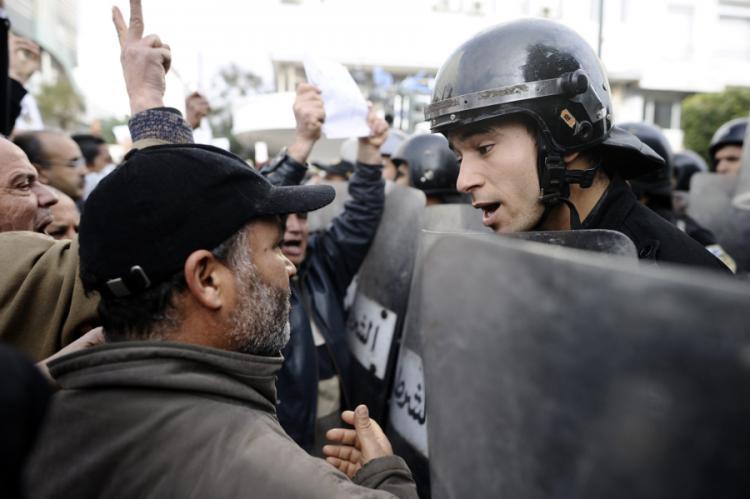 <a><img src="https://www.theepochtimes.com/assets/uploads/2015/09/108151625_Tunisia_2.jpg" alt="A Tunisian protester talks to a policemen during a demonstration. (Fred Dufour/AFP/Getty Images)" title="A Tunisian protester talks to a policemen during a demonstration. (Fred Dufour/AFP/Getty Images)" width="320" class="size-medium wp-image-1809470"/></a>