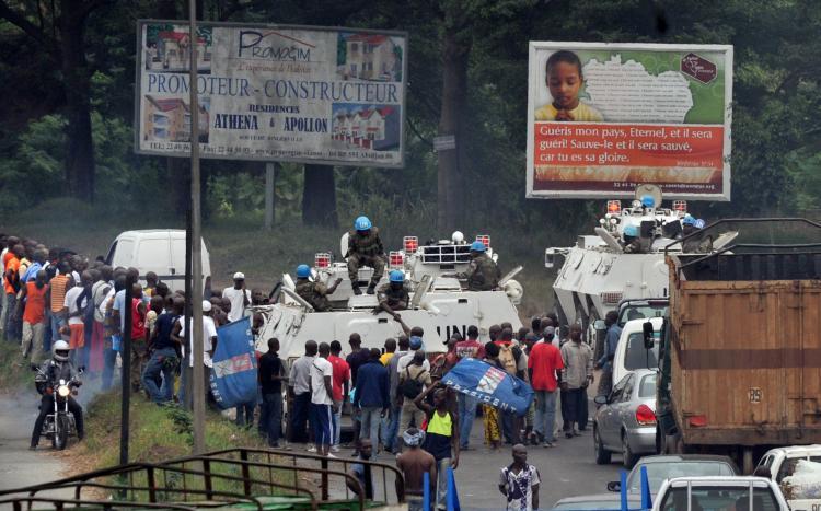 <a><img src="https://www.theepochtimes.com/assets/uploads/2015/09/108285638.jpg" alt="Supporters of incumbent Ivorian President Laurent Gbagbo block a convoy of UN peacekeepers on January 24 in Abidjan. Alassane Ouattara, internationally recognized as the winner of Ivory Coast's election, tried to choke off funding for his rival Laurent Gbagbo on Monday by ordering a halt to cocoa and coffee exports. (Issouf Sanogo/Getty Images )" title="Supporters of incumbent Ivorian President Laurent Gbagbo block a convoy of UN peacekeepers on January 24 in Abidjan. Alassane Ouattara, internationally recognized as the winner of Ivory Coast's election, tried to choke off funding for his rival Laurent Gbagbo on Monday by ordering a halt to cocoa and coffee exports. (Issouf Sanogo/Getty Images )" width="320" class="size-medium wp-image-1809277"/></a>
