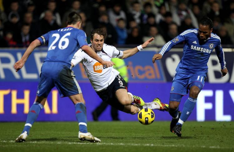 <a><img src="https://www.theepochtimes.com/assets/uploads/2015/09/108293582.jpg" alt="Johan Elmander of Bolton Wanderers tangles with Didier Drogba of Chelsea during the Barclays Premier League match between Bolton Wanderers and Chelsea at the Reebok Stadium on January 24, 2011 in Bolton, England.   (Michael Steele/Getty Images )" title="Johan Elmander of Bolton Wanderers tangles with Didier Drogba of Chelsea during the Barclays Premier League match between Bolton Wanderers and Chelsea at the Reebok Stadium on January 24, 2011 in Bolton, England.   (Michael Steele/Getty Images )" width="320" class="size-medium wp-image-1809279"/></a>