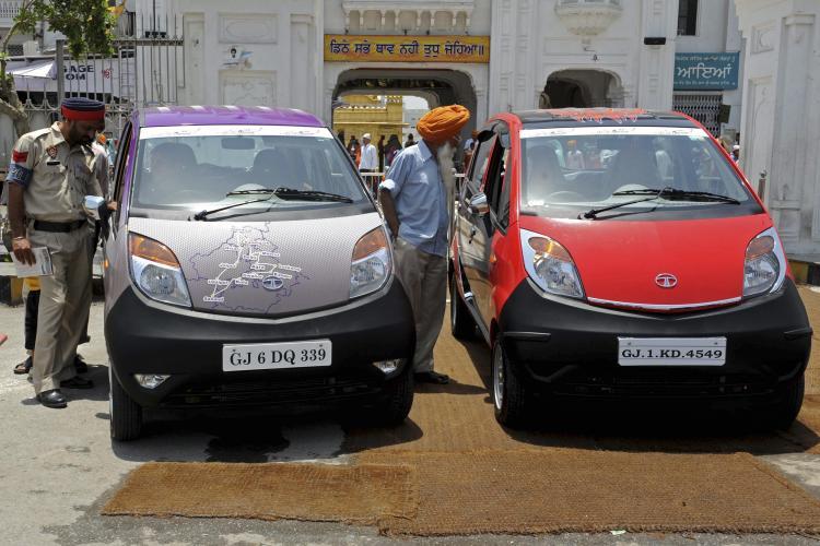 <a><img src="https://www.theepochtimes.com/assets/uploads/2015/09/109690735.jpg" alt="INSPECTING: Bystanders take a closer look at Tata Nano cars, billed as the 'world's cheapest car,' taking part in a road tour in Amritsar, India on June 9, 2010. (Narinder Nanu/AFP/Getty Images )" title="INSPECTING: Bystanders take a closer look at Tata Nano cars, billed as the 'world's cheapest car,' taking part in a road tour in Amritsar, India on June 9, 2010. (Narinder Nanu/AFP/Getty Images )" width="320" class="size-medium wp-image-1805269"/></a>