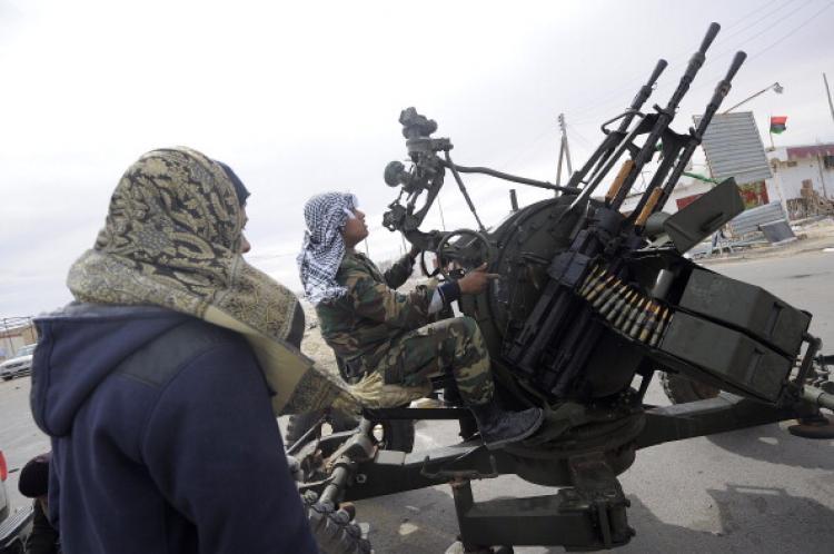 <a><img src="https://www.theepochtimes.com/assets/uploads/2015/09/110034607.jpg" alt="Libyan rebels man an anti-aircraft machine gun on March 13, 2011 at the last rebel-held checkpoint of Brega, before heavy shelling from forces loyal to strongman Moamer Kadhafi pulled dozens of them out of the eastern town. (Gianliuigi Guercia/AFP/Getty Images)" title="Libyan rebels man an anti-aircraft machine gun on March 13, 2011 at the last rebel-held checkpoint of Brega, before heavy shelling from forces loyal to strongman Moamer Kadhafi pulled dozens of them out of the eastern town. (Gianliuigi Guercia/AFP/Getty Images)" width="320" class="size-medium wp-image-1806783"/></a>