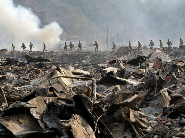 <a><img src="https://www.theepochtimes.com/assets/uploads/2015/09/110035692.jpg" alt="Self Defence troops walk through debris to search for missing people at Otsuchi town in Iwate prefecture on March 13, 2011. Japanese authorities warned on Sunday that the Fukushima Daiichi No. 3 Reactor could explode. (Jiji Press/AFP/Getty Images)" title="Self Defence troops walk through debris to search for missing people at Otsuchi town in Iwate prefecture on March 13, 2011. Japanese authorities warned on Sunday that the Fukushima Daiichi No. 3 Reactor could explode. (Jiji Press/AFP/Getty Images)" width="320" class="size-medium wp-image-1806858"/></a>