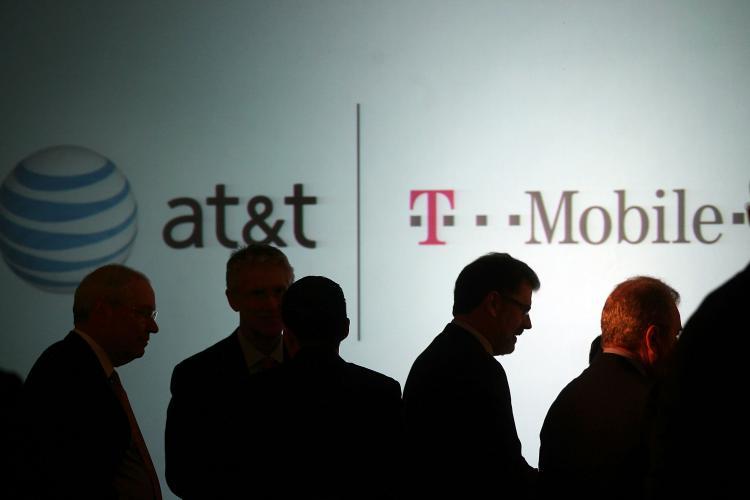 <a><img src="https://www.theepochtimes.com/assets/uploads/2015/09/110501014.jpg" alt="Executives at AT&T attend a news conference where it was announced that AT&T Inc. will be buying its wireless rival T-Mobile USA from Deutsche Telekom AG for $39 billion in cash and stock on March 21, 2011 in New York City.   (Spencer Platt/Getty Images)" title="Executives at AT&T attend a news conference where it was announced that AT&T Inc. will be buying its wireless rival T-Mobile USA from Deutsche Telekom AG for $39 billion in cash and stock on March 21, 2011 in New York City.   (Spencer Platt/Getty Images)" width="320" class="size-medium wp-image-1806548"/></a>