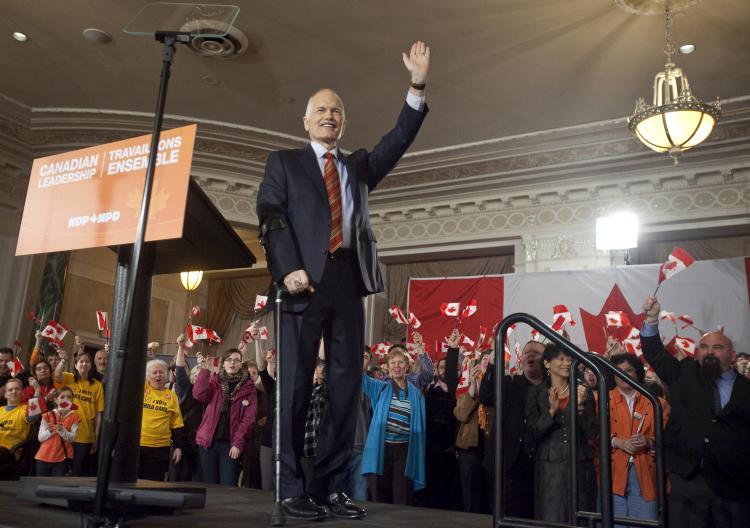 <a><img src="https://www.theepochtimes.com/assets/uploads/2015/09/110908139.jpg" alt="New Democratic Party leader Jack Layton waves during NDP's campaign kickoff event at the Chateau Laurier in Ottawa, Canada, on March 26. The latest poll released Wednesday by Forum Research showed that NDP was closing in on the front running Conservatives with 31 percent support compared to 34 percent for the Tories. (Geoff Robins/AFP/Getty Images)" title="New Democratic Party leader Jack Layton waves during NDP's campaign kickoff event at the Chateau Laurier in Ottawa, Canada, on March 26. The latest poll released Wednesday by Forum Research showed that NDP was closing in on the front running Conservatives with 31 percent support compared to 34 percent for the Tories. (Geoff Robins/AFP/Getty Images)" width="320" class="size-medium wp-image-1799030"/></a>