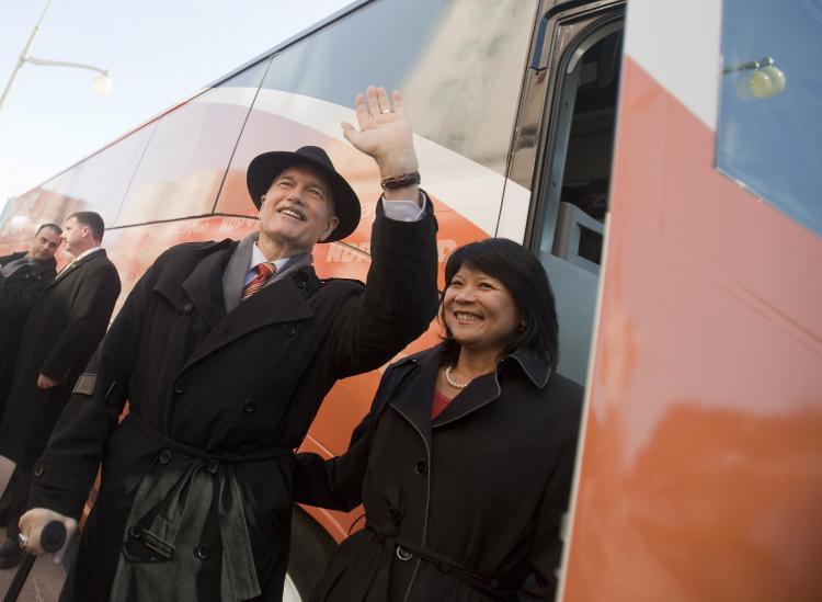 <a><img src="https://www.theepochtimes.com/assets/uploads/2015/09/110908282.jpg" alt="New Democratic Party leader Jack Layton waves to the crowd as he boards the bus with his wife, NDP Member of Parliament Olivia Chow, following the NDP's campaign kickoff event at the Chateau Laurier in Ottawa on March 26. (Geoff Robins/AFP/Getty Images)" title="New Democratic Party leader Jack Layton waves to the crowd as he boards the bus with his wife, NDP Member of Parliament Olivia Chow, following the NDP's campaign kickoff event at the Chateau Laurier in Ottawa on March 26. (Geoff Robins/AFP/Getty Images)" width="320" class="size-medium wp-image-1804917"/></a>