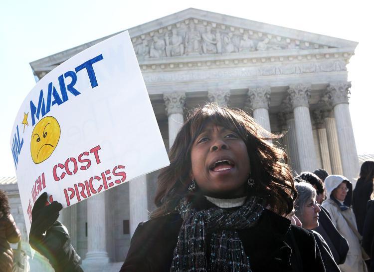 <a><img src="https://www.theepochtimes.com/assets/uploads/2015/09/111061867.jpg" alt="DISCRIMINATION: Activist Kellye McIntosh of Alliance for Justice holds a sign during a rally in front of the U.S. Supreme Court March 29 in Washington. The Supreme Court has started to hear arguments on whether the world's biggest retailer systematically discriminated against women in stores across America and should go forward and proceed as a class action suit.  (Alex Wong/Getty Images )" title="DISCRIMINATION: Activist Kellye McIntosh of Alliance for Justice holds a sign during a rally in front of the U.S. Supreme Court March 29 in Washington. The Supreme Court has started to hear arguments on whether the world's biggest retailer systematically discriminated against women in stores across America and should go forward and proceed as a class action suit.  (Alex Wong/Getty Images )" width="320" class="size-medium wp-image-1806172"/></a>